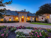 Verano House Plan front view at dusk