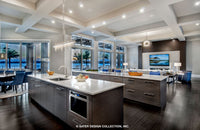Waters Edge House Plan&#39;s kitchen with its views of the lanai