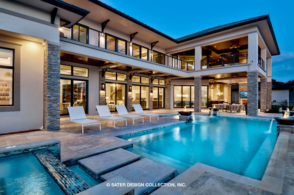 Waters Edge House Plan&#39;s pool and lanai at dusk