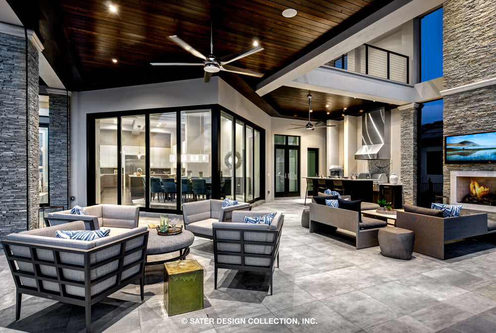 Waters Edge House Plan&#39;s Solana and outdoor fireplace